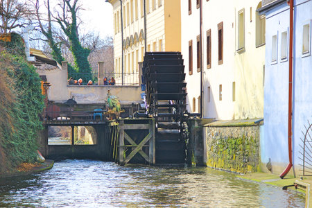 An old water mill at the house on the Vltava River in Pragueの写真素材