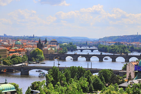 Bridges over the Vltava River in Prague on a sunny day against a blue skyの写真素材