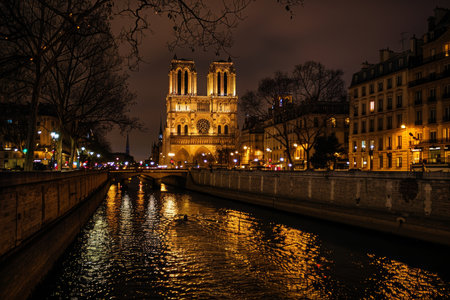 Notre dame cathedral and seine river night view in paris, iconic landmarks and cityscapeの素材