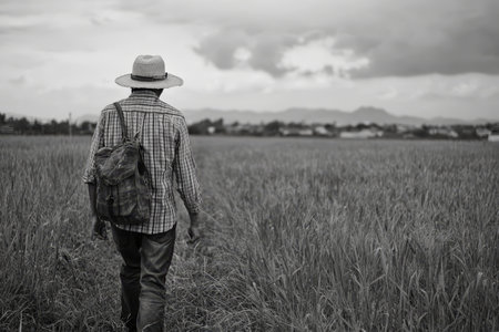 A weary modern man escapes the chaos of city life for the peaceful solitude of the countrysideの素材