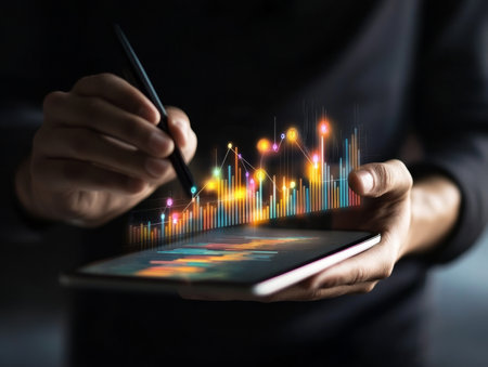 Businessman analyzing financial data on digital tablet with growth chart for strategic planningの写真素材