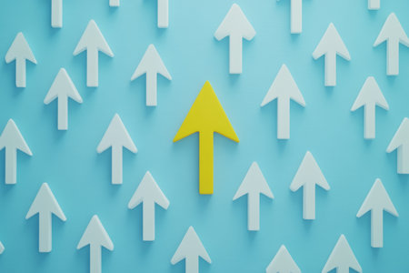 Yellow arrow leading among white arrows on blue background symbolizing direction and leadershipの写真素材