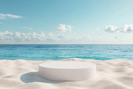 Elegant round podium on sandy beach with blue sea, ideal for summer product display mockupの写真素材