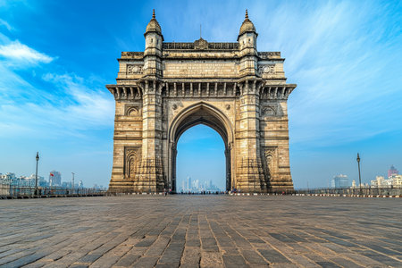 Stunning front view of the gateway of India in Mumbai under bright blue sky and daylightの写真素材