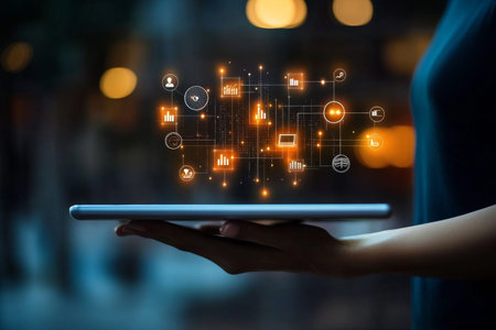 Hand holding tablet displaying digital data and business icons for it services and innovation