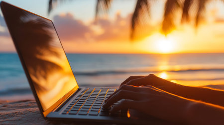 Remote work bliss a person typing on a laptop against a stunning beach sunset backdropの写真素材