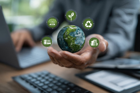 Businessman showcasing green earth with eco icons while working on sustainable business conceptsの写真素材