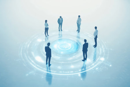 Business professionals in a circle with digital hologram on light blue backgroundの写真素材