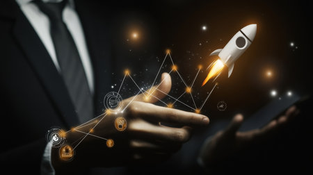 Businessman interacting with growth graph and rocket icons on black background, symbolizing successの写真素材