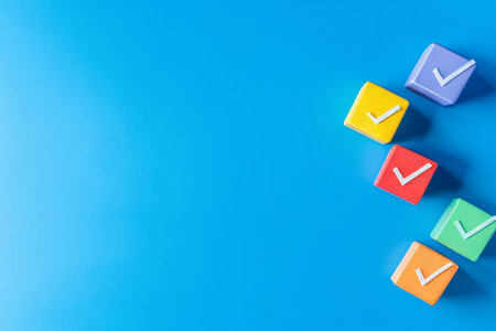 Colorful cube shaped checkmark on blue background business plan concept with copy spaceの写真素材
