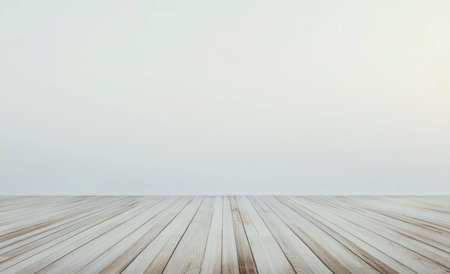 Bright and spacious empty room with light wood flooring and large window showing clear skyの写真素材