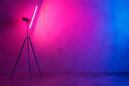 Minimalist photography studio with pink and blue neon lights for graphic design mockup