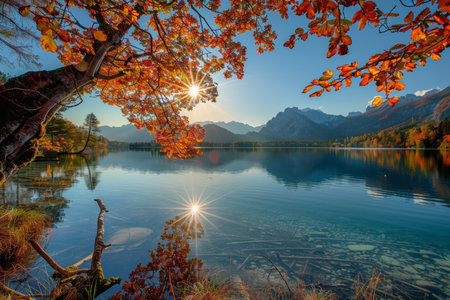 Vivid autumn sunset at hintersee lake on a sunny day, creating a breathtaking viewの写真素材