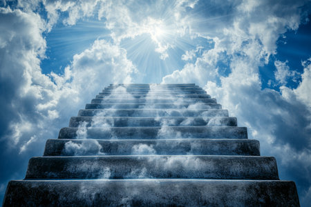 Heavenly stairs ascending to the sky, bathed in sunlight and surrounded by white cloudsの写真素材