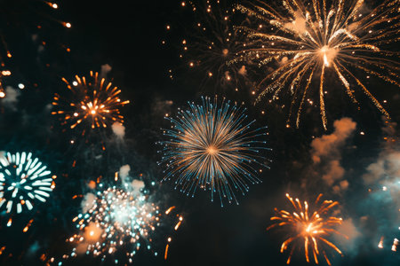 Vibrant fireworks against a black background perfect for new year s and festive celebrationsの写真素材