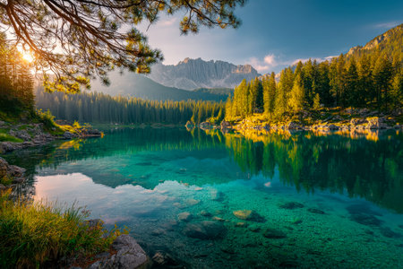 Tranquil alpine pond fringed by dense conifers, mirroring rugged peaks and blue sky, evoking peace...