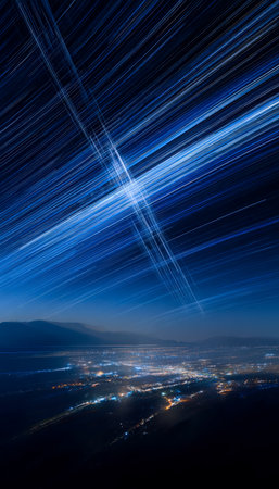 Vibrant urban skyline illuminated against a dark sky, showcasing long-exposure star trails intertwined with streaks of city lights creating a mesmerizの写真素材
