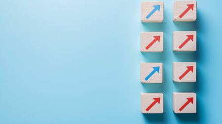 Wooden building blocks arranged with arrows pointing upward and to the right symbolize advancement,...