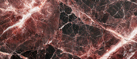 A detailed view of polished marble showcasing deep crimson and black swirls accented by delicate white and blush pink streaks, exuding luxury and elegの写真素材