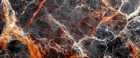 A detailed view of a deep-toned marble slab featuring striking orange, white, and gray streaks that create a luxurious, natural pattern.の写真素材