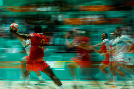 Dynamic handball players demonstrate speed and agility in summer olympics fast breakの写真素材