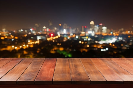 Empty board table on office terrace with stunning city view at night, business workspace conceptの写真素材