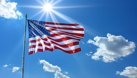 Elegant american flag gracefully waving on a picturesque sunny day, creating a stunning scene