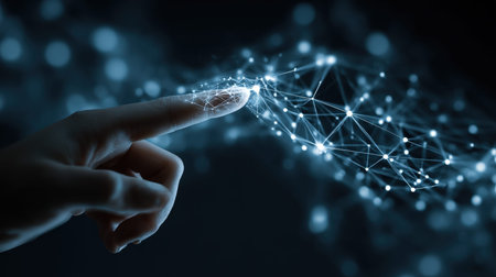 A human hand reaches out to a luminous web of digital connections, flickering softly against a...