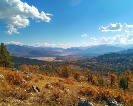 Sunny day panorama of majestic autumn mountain landscape with vibrant colors and clear blue skyの写真素材