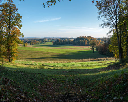 Enchanting autumn landscape. sunny panoramic view of rural idyll in the countrysideの写真素材