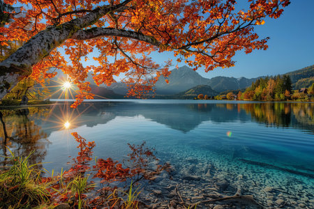 Spectacular autumn sunset at hintersee lake on a sunny day, showcasing the beauty of natureの写真素材