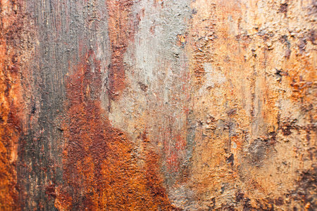 An aged, weathered metal plate displays intricate rust patterns and uneven corrosion, evoking a gritty, industrial aesthetic perfect for vintage or inの写真素材