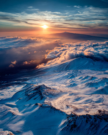 Majestic icy peaks glow under a fiery sunset, with swirling clouds painting the sky in vivid hues, evoking awe in wilderness lovers.の写真素材