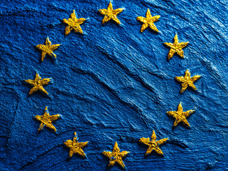 A radiant circle of shining gold stars contrasts beautifully against a rich, textured blue backdrop,...