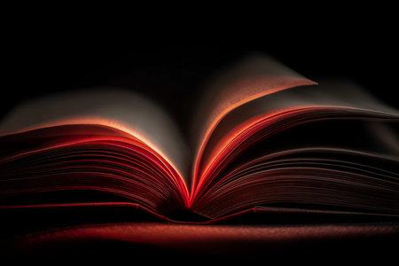 In a shadowy environment, an open book's pages emit a gentle, magical light, creating an enchanting...