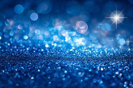 A luminous swirl of vibrant blue hues embellished with tiny glowing specks and radiant shimmer, creating a dreamy, festive atmosphere ideal for celebrations and elegance.の写真素材