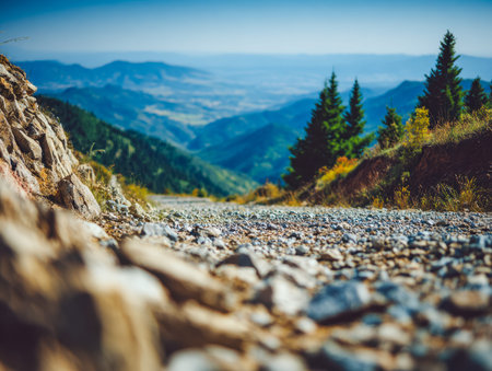 A winding trail weaves through vibrant evergreens, leading toward gentle hills that fade into the...
