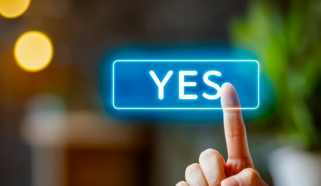 A sleek digital interface featuring a vibrant, illuminated "yes" button inspiring confirmation and positive decision-making.の写真素材