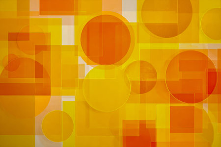 A lively blend of semi-transparent orange and yellow shapes an energetic pattern, evoking a sense of movement and bold originality in contemporary art displays.の写真素材