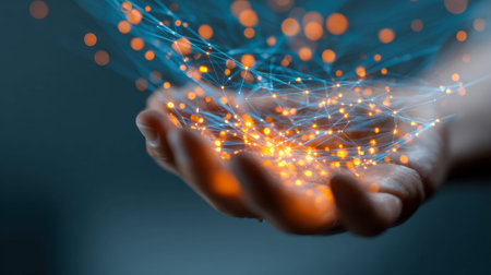 A human hand cradles luminous, interwoven particles symbolizing advanced digital links and...