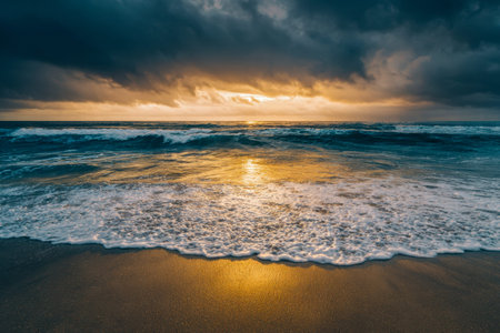 Warm rays shimmer across restless waves, illuminating the tranquil sand below as dark storm clouds...