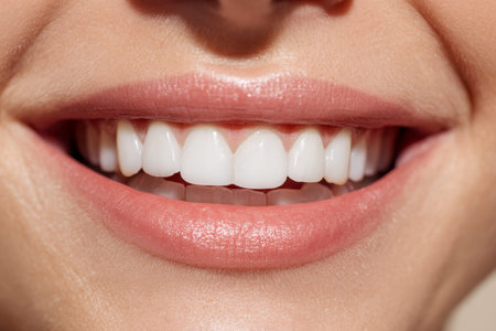 A cheerful expression radiant, perfectly aligned teeth and smooth pink lips, emphasizing the...