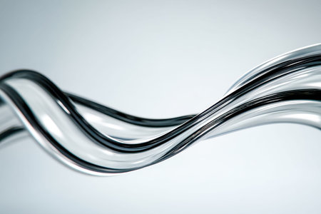 A detailed view of looping metallic cylinders merges into complex patterns, evoking a sense of...