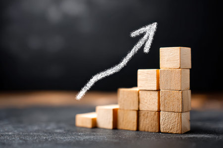 An arrangement of wooden blocks ascending in height, topped with a dynamic arrow pointing upward,...