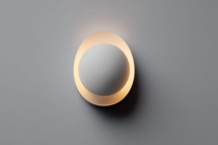 A sleek, contemporary wall fixture featuring a circular metallic ring that emits gentle, ambient...