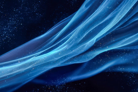 Wisps of luminous azure vapor drift seamlessly through a shadowed space, dotted with shimmering particles that evoke a sense of cosmic enchantment.の写真素材