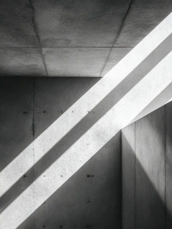 A sleek, contemporary space featuring intersecting beams of sunlight that create striking shadows across rugged concrete surfaces, highlighting clean lines and minimの写真素材