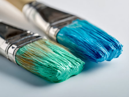 Brightly colored oil brushes rest on a pristine white background, inspiring fresh artistic visions and inventive expressions for new creative masterpieces.の写真素材