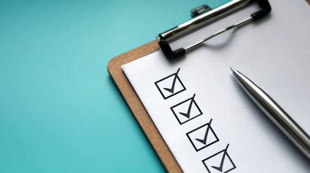 A sleek pen rests atop a neatly organized list of accomplished goals, set against a calming blue backdrop that evokes focus, efficiency, and meticulous planning.の写真素材