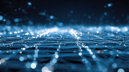 A captivating blue-tinted digital landscape featuring luminous points and intricate lines, creating a sense of advanced connectivity within a mysterious dark cosmos.の写真素材